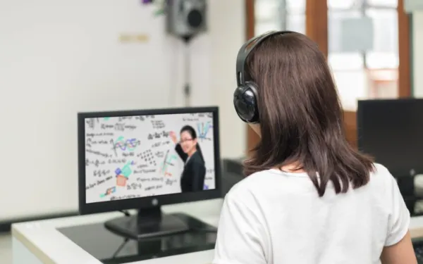 Student watching a video on a monitor